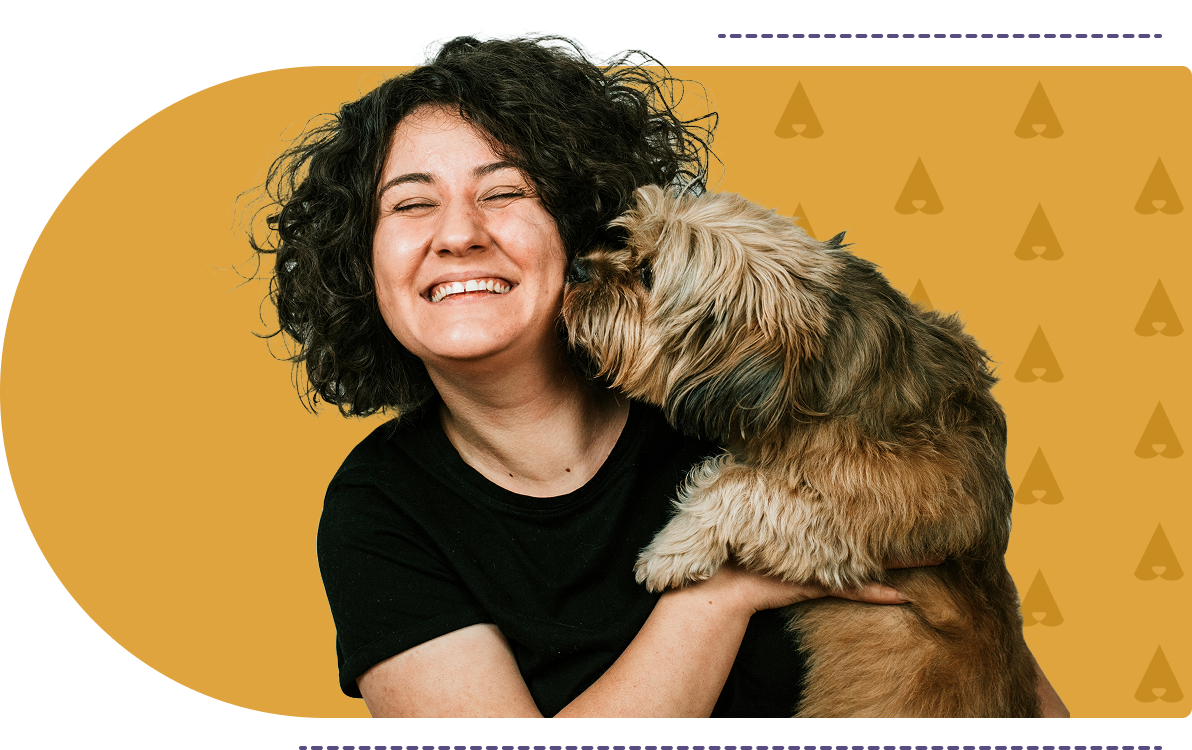 Woman with dog against yellow background